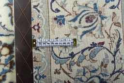 Backside of handmade New Nain rug showing knot structure and weave density