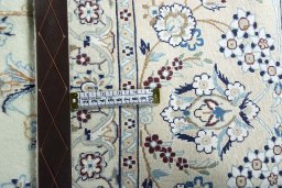 Backside of handmade New Nain rug showing knot structure and weave density