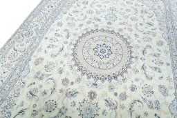 Backside of handmade New Nain rug showing knot structure and weave density