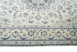 Corner detail of New Nain rug showing border pattern and Wool pile