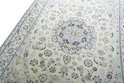 Backside of handmade New Nain rug showing knot structure and weave density