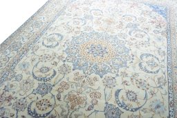 Backside of handmade New Nain rug showing knot structure and weave density