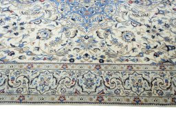 Corner detail of New Nain rug showing border pattern and Wool pile