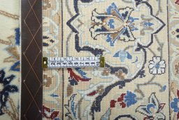 Backside of handmade New Nain rug showing knot structure and weave density