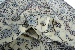 Surface texture of New Nain rug with natural Wool and intricate pattern