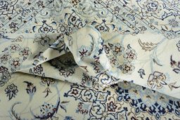 Surface texture of New Nain rug with natural Wool and intricate pattern