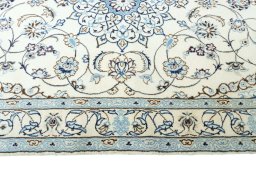 Corner detail of New Nain rug showing border pattern and Wool pile