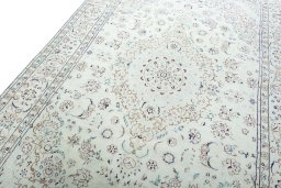 Backside of handmade New Nain rug showing knot structure and weave density