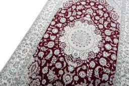 Backside of handmade New Nain rug showing knot structure and weave density