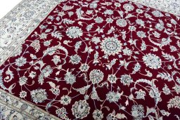 Backside of handmade New Nain rug showing knot structure and weave density