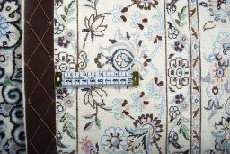Backside of handmade New Nain rug showing knot structure and weave density