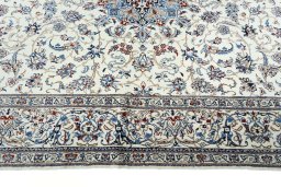 Corner detail of 2000s Nain rug showing border pattern and Cork pile