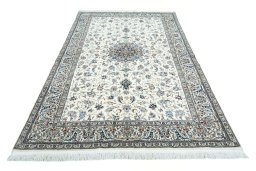 Surface texture of 2000s Nain rug with natural Cork and intricate pattern