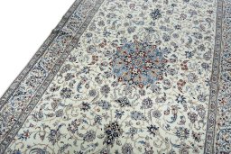 Backside of handmade 2000s Nain rug showing knot structure and weave density