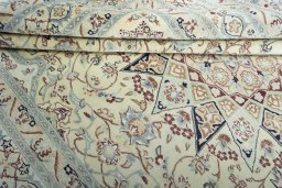 Close-up detail of 2000s Nain rug from Iran / Persia showing Wool weave