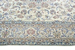 Corner detail of New Nain rug showing border pattern and Silk pile