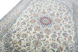 Backside of handmade New Nain rug showing knot structure and weave density