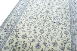Backside of handmade New Nain rug showing knot structure and weave density