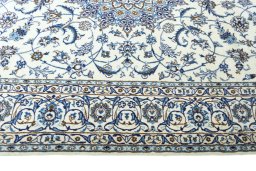 Corner detail of New Nain rug showing border pattern and Wool pile
