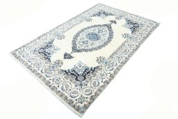Corner detail of New Nain rug showing border pattern and Wool pile