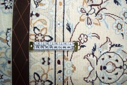 Backside of handmade New Nain rug showing knot structure and weave density
