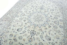 Backside of handmade New Nain rug showing knot structure and weave density