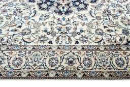 Corner detail of New Nain rug showing border pattern and Wool pile