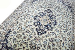 Backside of handmade New Nain rug showing knot structure and weave density