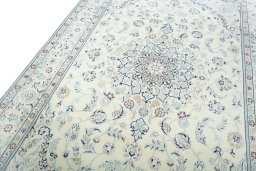 Backside of handmade New Nain rug showing knot structure and weave density
