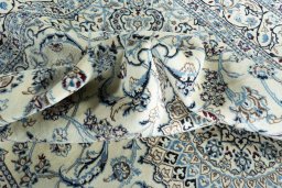 Surface texture of New Nain rug with natural Wool and intricate pattern