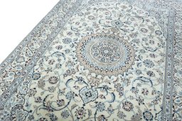 Backside of handmade New Nain rug showing knot structure and weave density