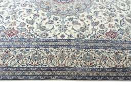 Corner detail of 2000s Nain rug showing border pattern and Cork pile
