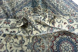 Surface texture of 2000s Nain rug with natural Cork and intricate pattern
