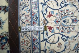 Backside of handmade 2000s Nain rug showing knot structure and weave density