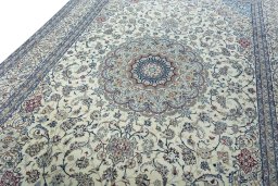 Backside of handmade 2000s Nain rug showing knot structure and weave density