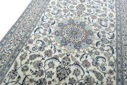 Backside of handmade New Nain rug showing knot structure and weave density