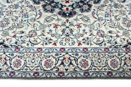 Corner detail of New Nain rug showing border pattern and Wool pile