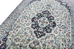 Backside of handmade New Nain rug showing knot structure and weave density