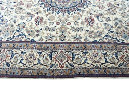 Corner detail of 2000s Nain rug showing border pattern and Wool pile
