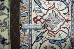 Backside of handmade 2000s Nain rug showing knot structure and weave density