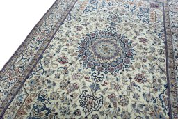 Backside of handmade 2000s Nain rug showing knot structure and weave density
