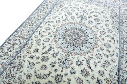 Backside of handmade New Nain rug showing knot structure and weave density