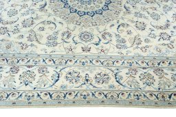 Corner detail of New Nain rug showing border pattern and Wool pile
