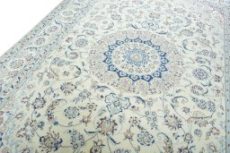 Backside of handmade New Nain rug showing knot structure and weave density