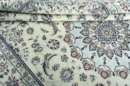Close-up detail of 2000s Nain rug from Iran / Persia showing Wool weave