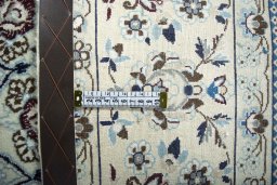 Backside of handmade 2000s Nain rug showing knot structure and weave density