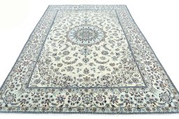 Surface texture of 2000s Nain rug with natural Wool and intricate pattern