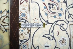 Backside of handmade New Nain rug showing knot structure and weave density