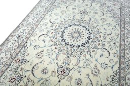 Backside of handmade New Nain rug showing knot structure and weave density