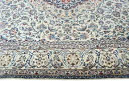 Corner detail of 2000s Nain rug showing border pattern and Wool pile